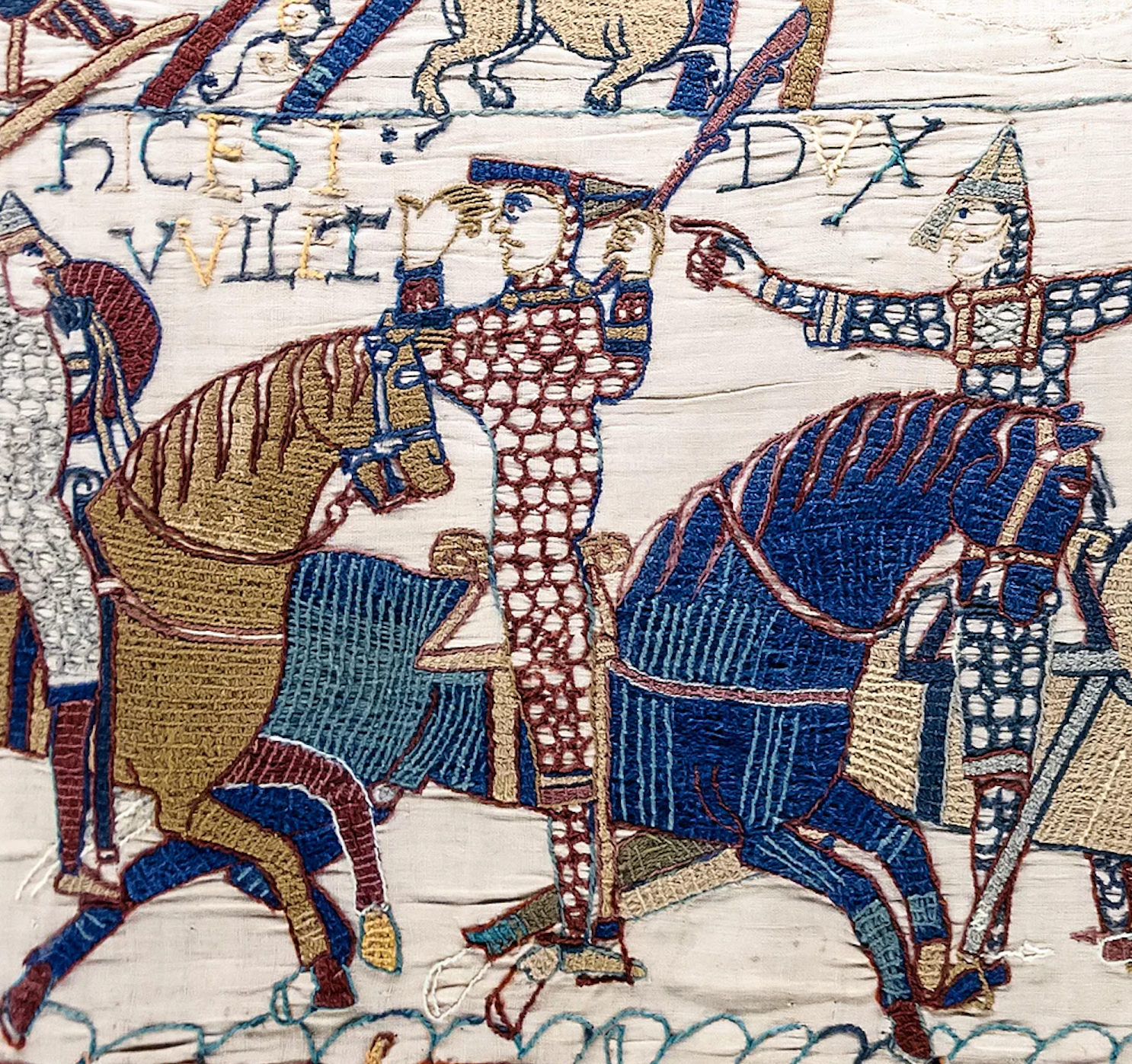 William lifts his helmet to show that he is still alive