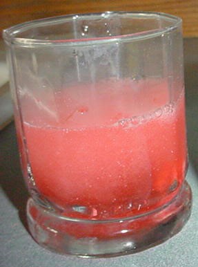 Cherry Alka-Seltzer dissolving in water