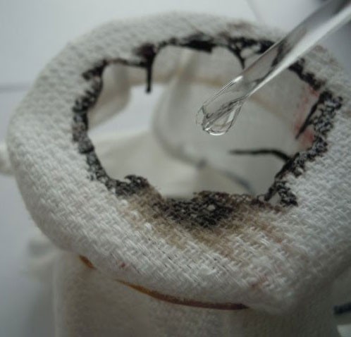 Sulphuric acid on a piece of cotton towel