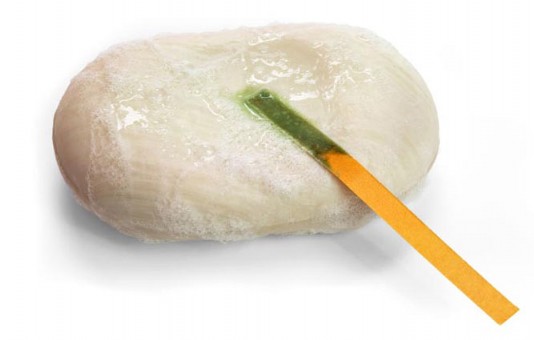 Litmus turns green on soap, which is alkaline.