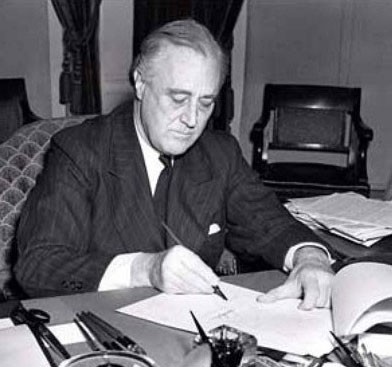 Roosevelt signs the Lend-Lease Act in 1941