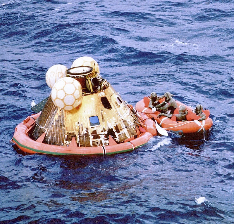 Navy divers assist the astronauts from Columbia.