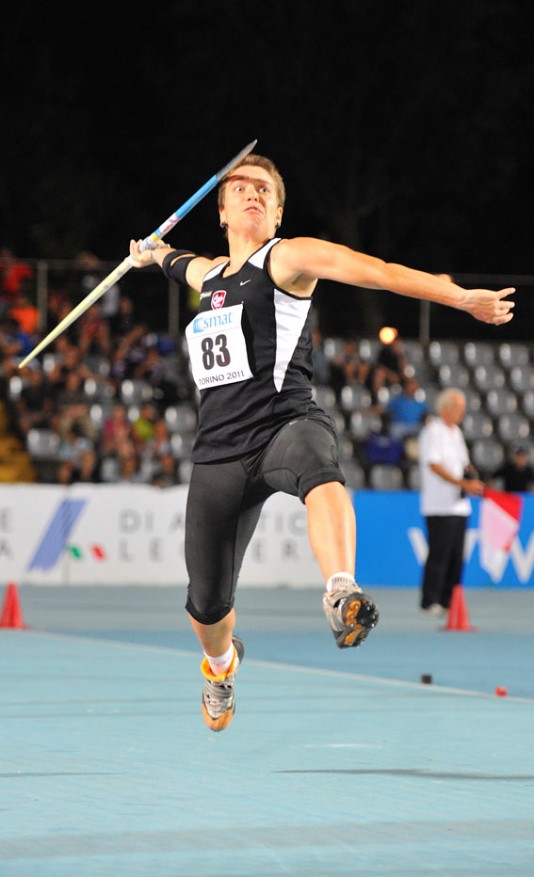 An athlete about to release her javelin