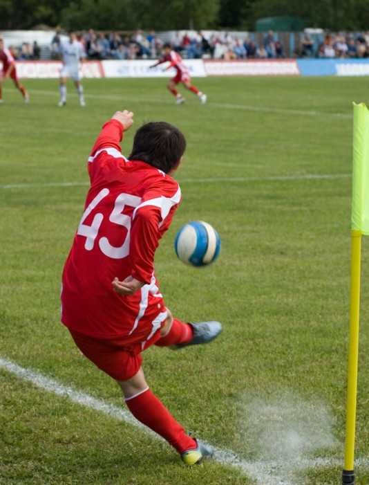A corner kick towards the penalty area