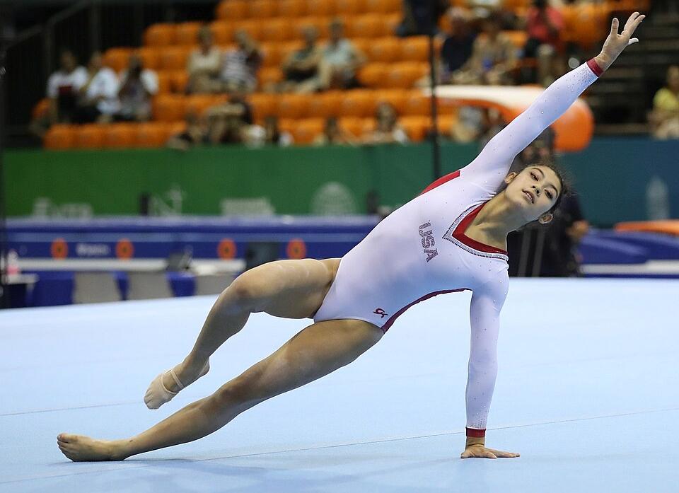 A gymnast performs her floor exercise routine