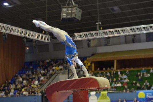 A gymnast on the vault at a tournament