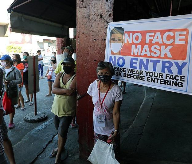 People wearing face masks in the Philippines, March 2020