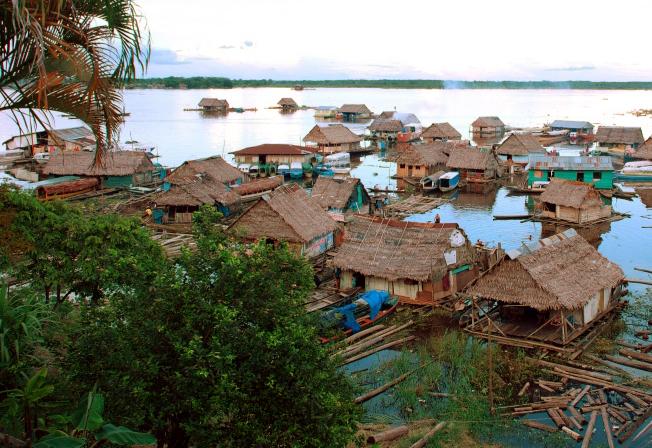 A floating village in the Amazon rainforest near Iquitos, Peru