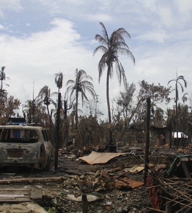 Burnt down house in a Rohingya village
