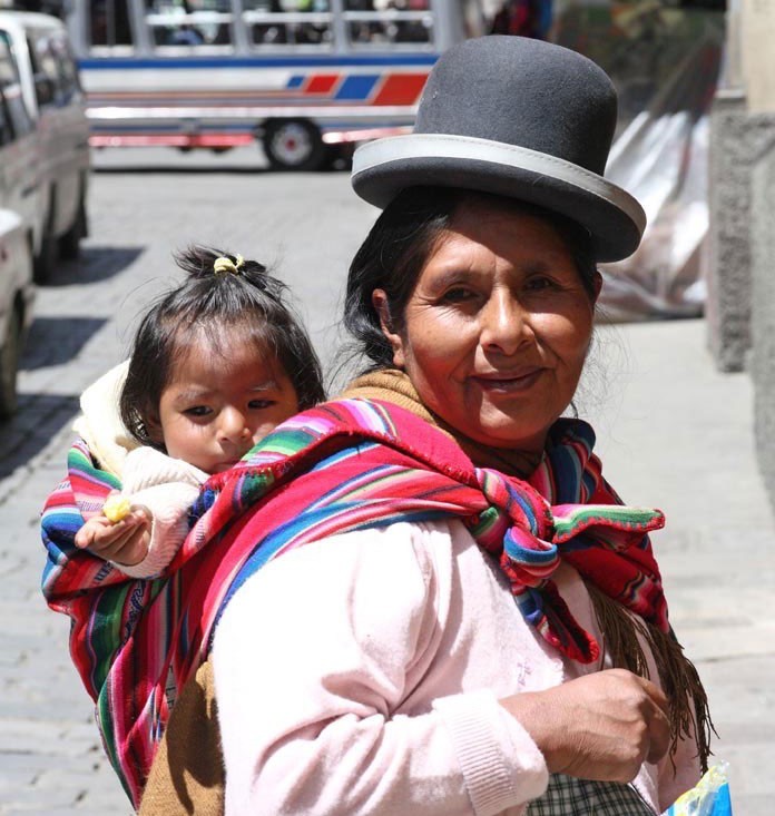 Amerindian woman carrying her baby