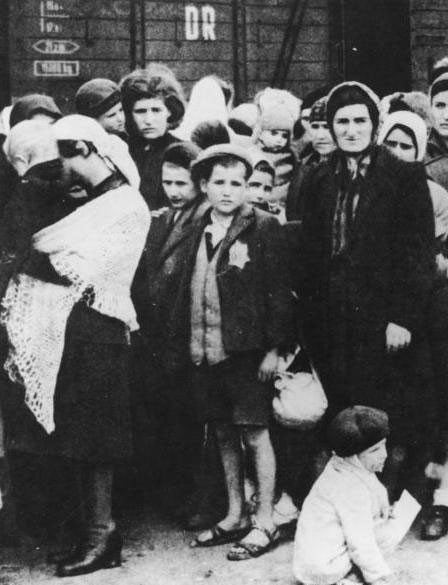 A Jewish boy (centre) wearing a Star of David