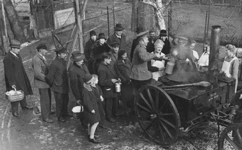 Soldiers feeding poor Germans, 1931
