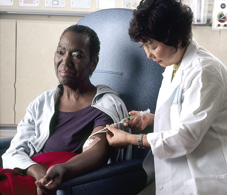 A nurse gives chemotherapy