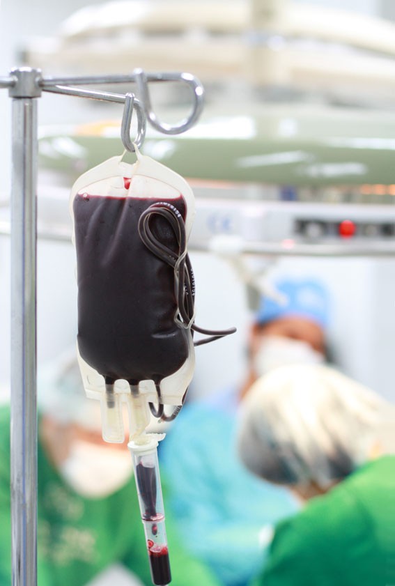 A blood transfusion in an operating room