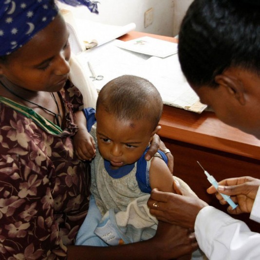 A modern photo of a child being vaccinated