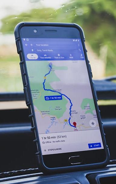 A smartphone with a web mapping navigation app open