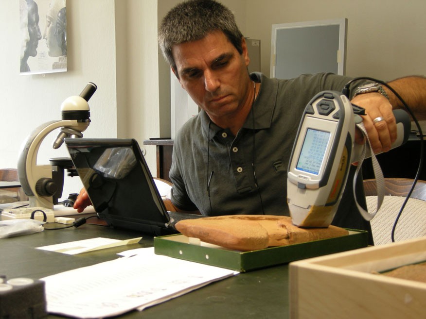 Archaeologist tests an ancient clay tablet