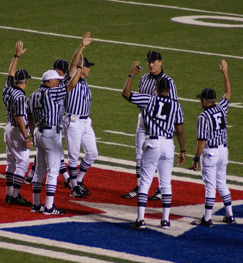 Officials discuss a call