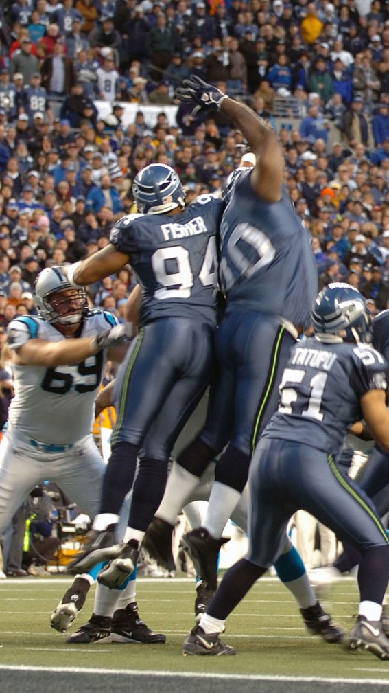 American football players make a block