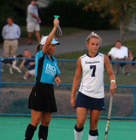 The umpire shows a green card.