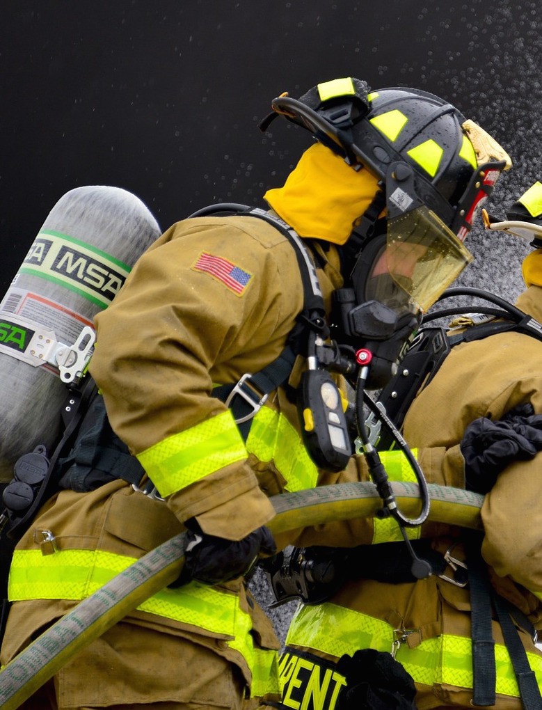 Firefighter with breathing equipment