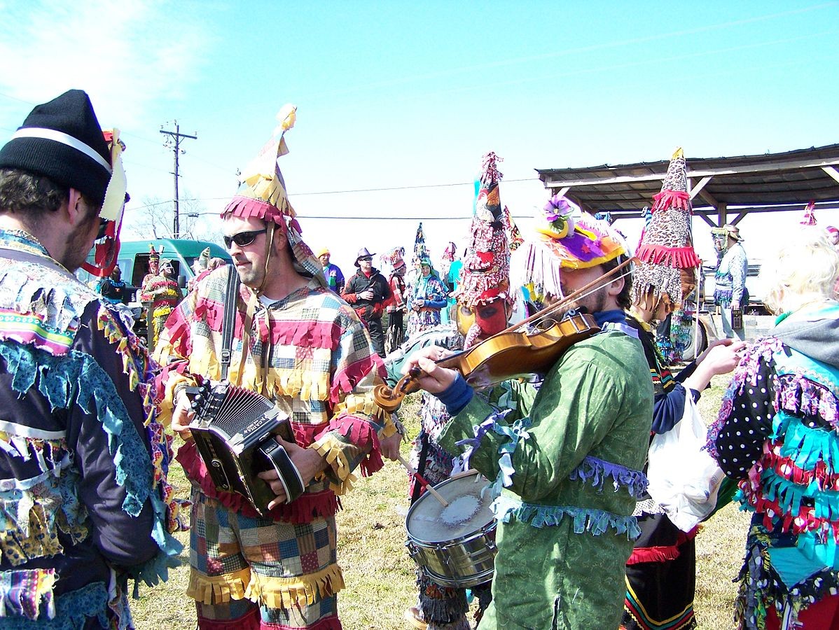 Cajun musicians playing at a Courir de Mardi Gras
