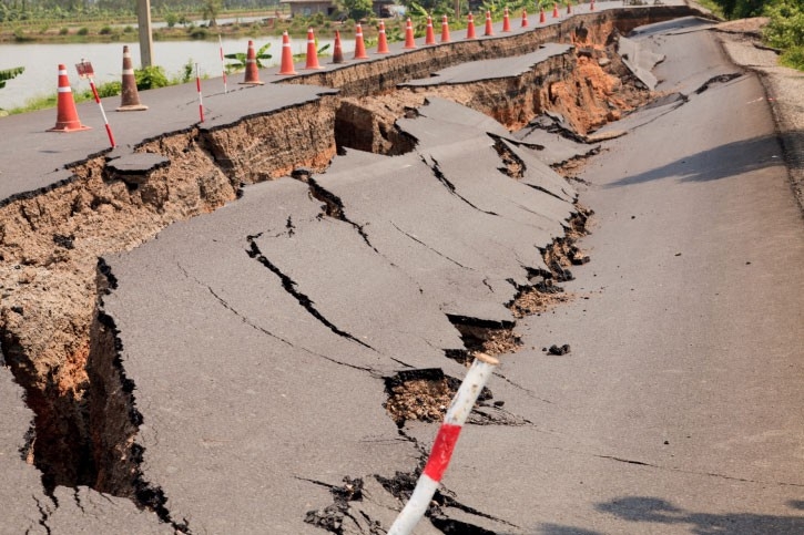 A road cracks open after an earthquake