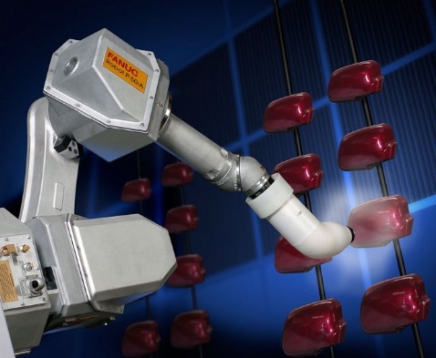 A robot spray-painting car wing mirrors