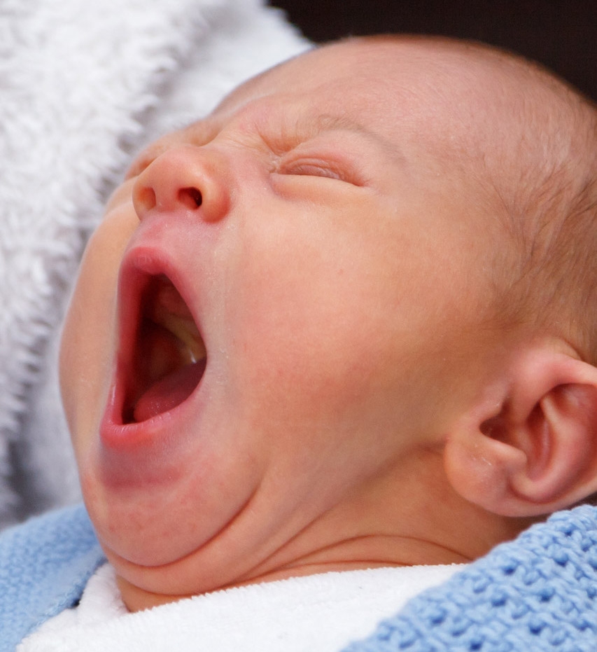 A baby yawning