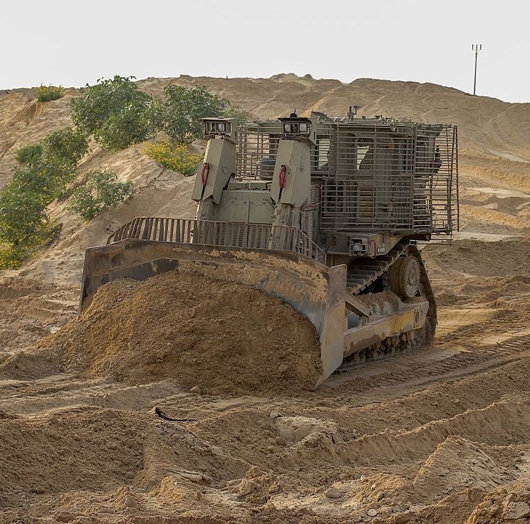 Armoured bulldozer with special mine plough