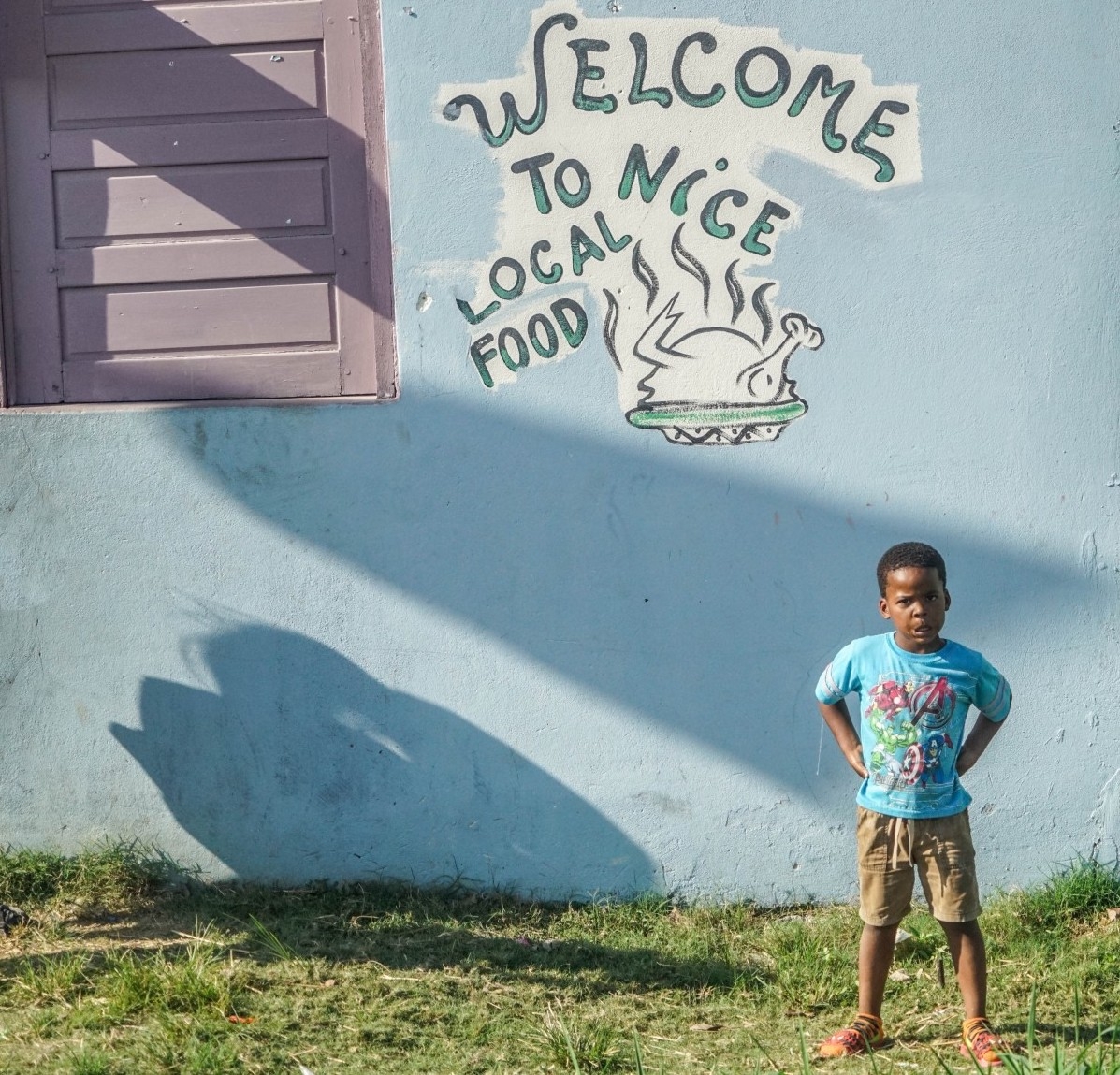 Belizean boy and English-language sign