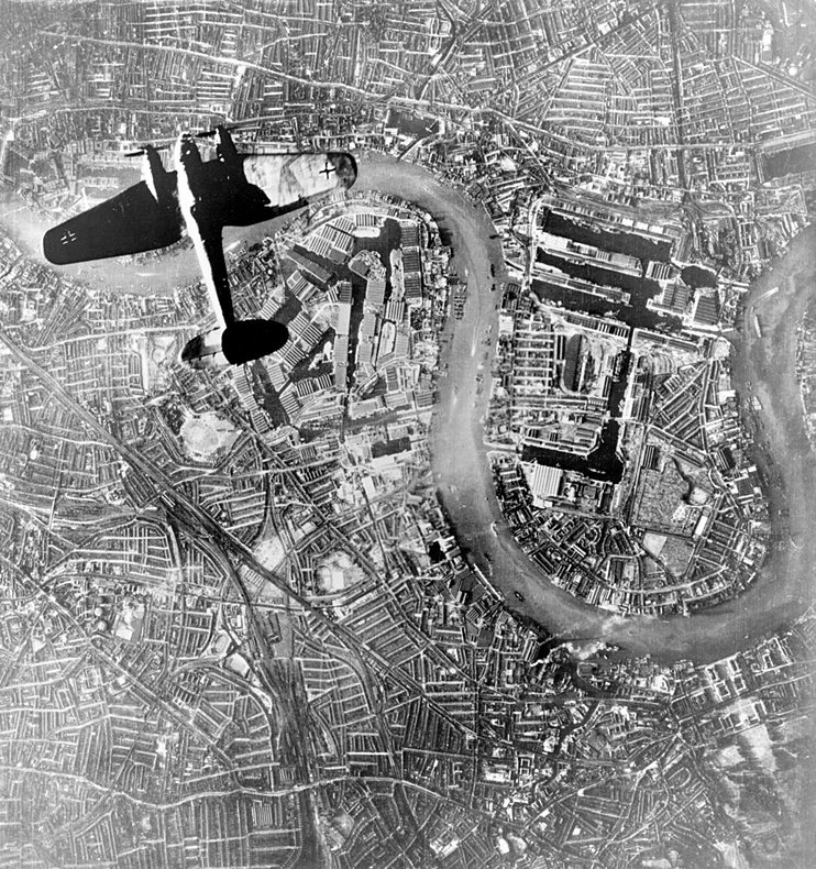 A German bomber flies over the Surrey Docks, 1940