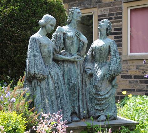 A statue of the Brontë sisters outside their childhood home in Haworth, Yorkshire.