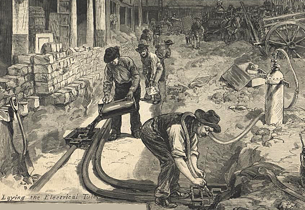 Workmen laying DC power lines under New York streets
