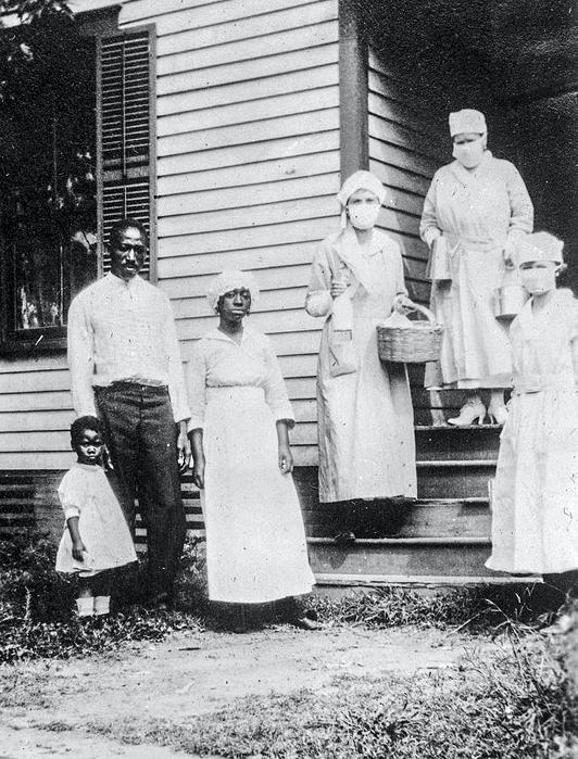 Red Cross workers take food for family infected with flu