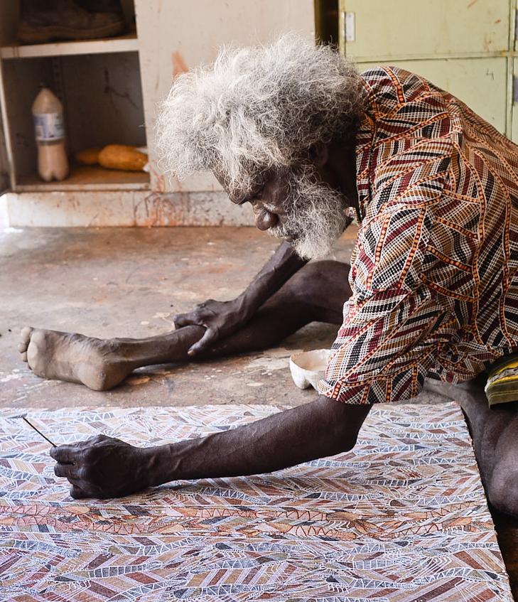 An Aboriginal Australian artist at work