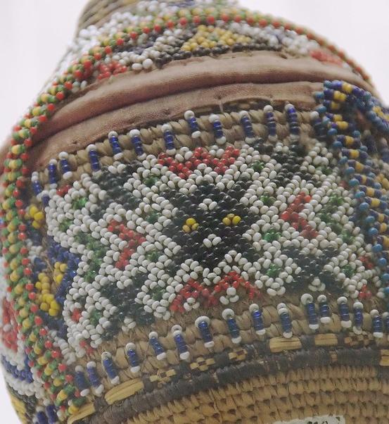 A beaded covering for a pot