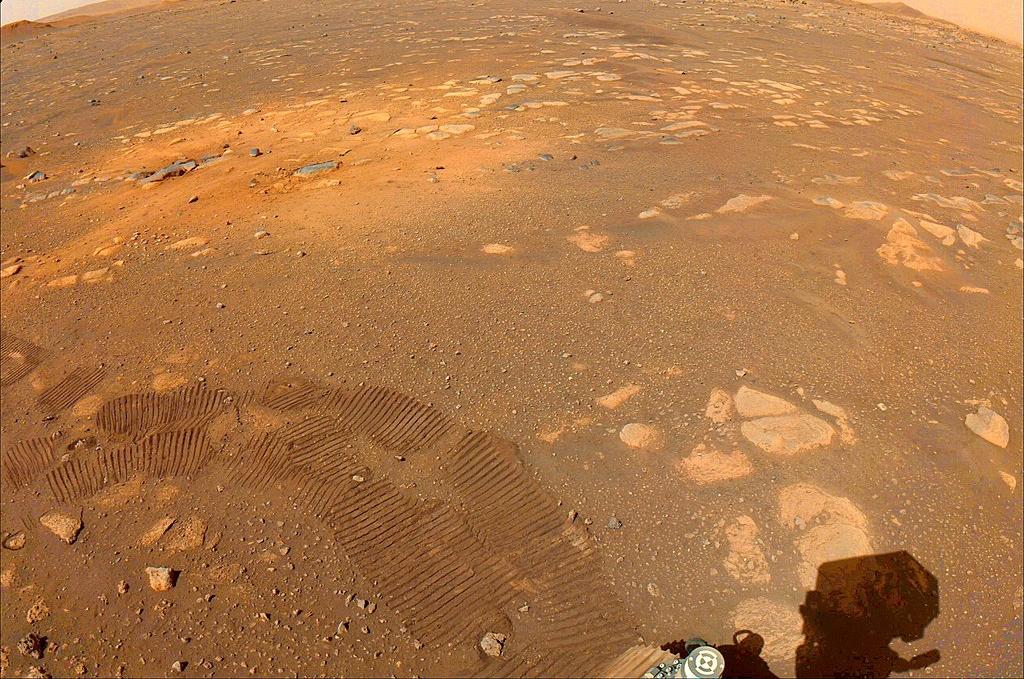 Tracks from the first drive and an area scoured by rocket engines