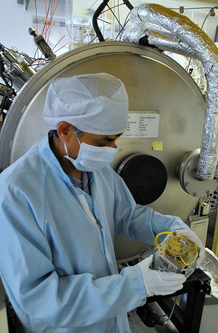 Scientist holding a CubeSat