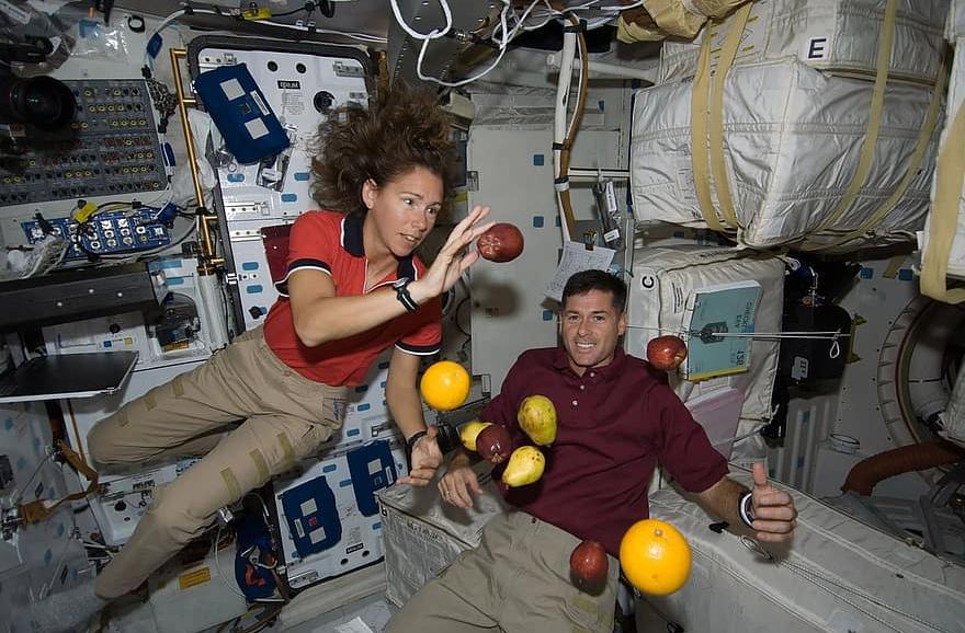 Astronauts aboard ISS demonstrating weightlessness