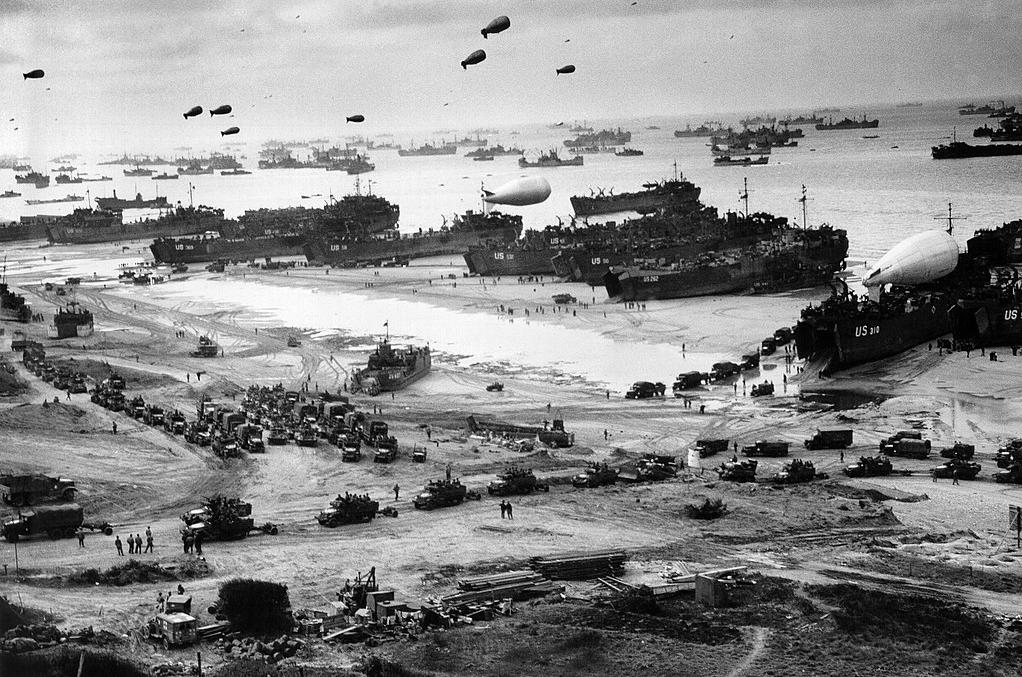Allied landing ships put cargo and troops ashore on Omaha Beach