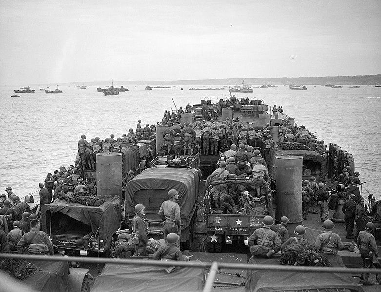 US troops and vehicles head towards the Normandy beaches