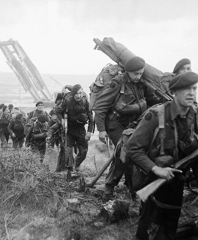 Royal Marines march inland from the Normandy beaches