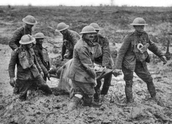 Stretcher bearers struggle through the mud