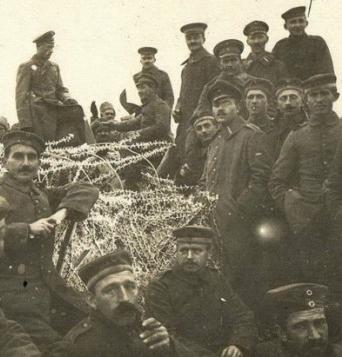 British and German soldiers pose for a photo