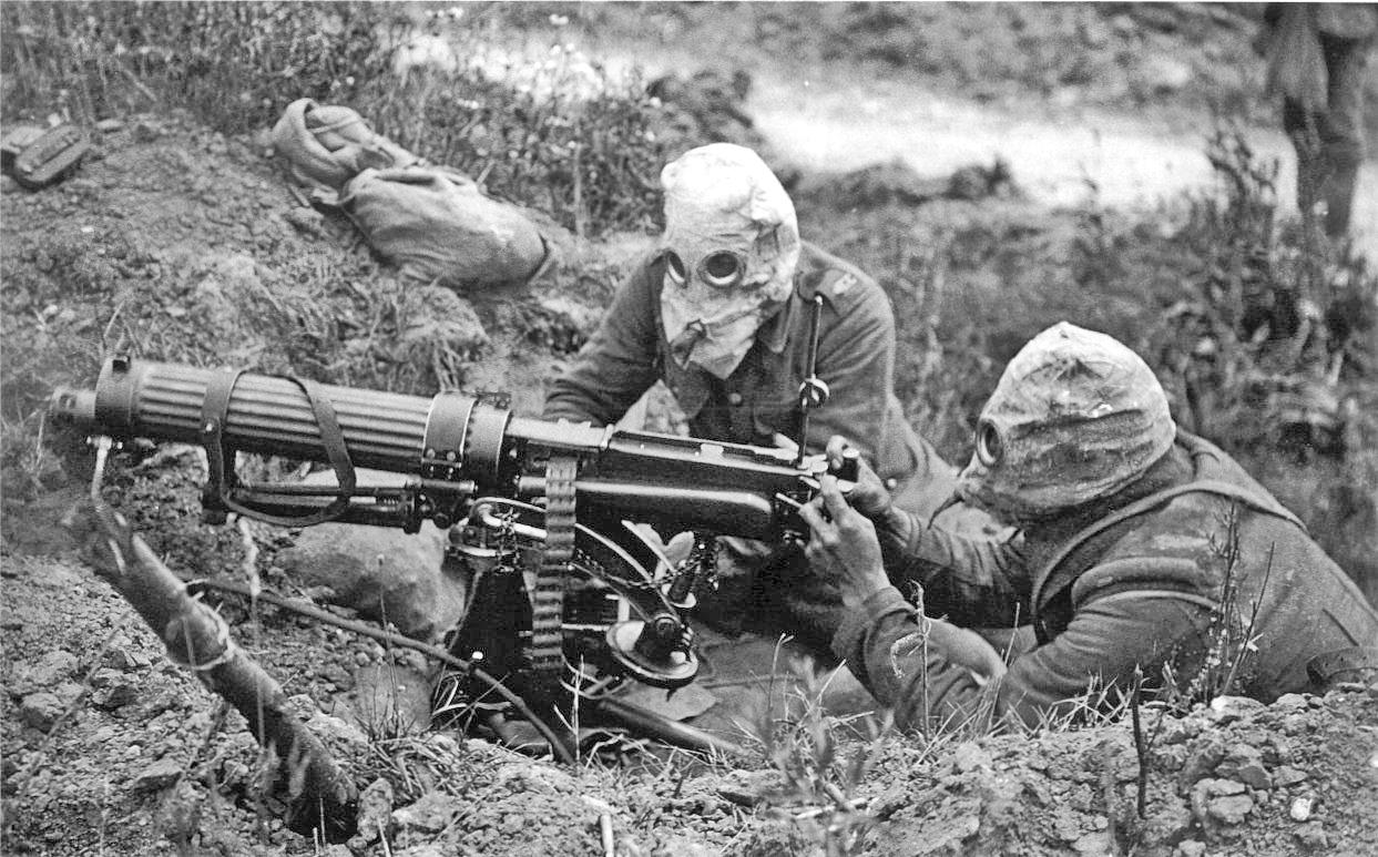 Machine gun crew wearing anti-gas "helmets", July 1916