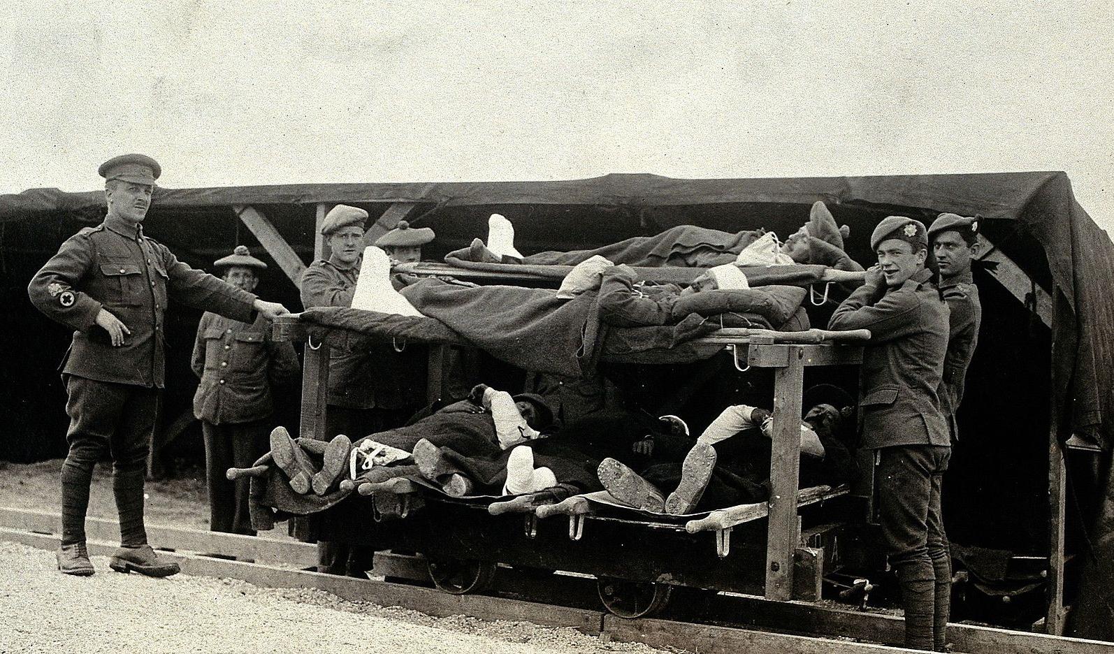 Wounded soldiers on a trolley at a Casualty Clearing Station