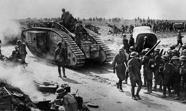 British tanks roll through German positions during the Hundred Days Offensive.