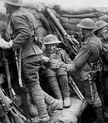 British troops in a trench armed with rifles and a machine gun
