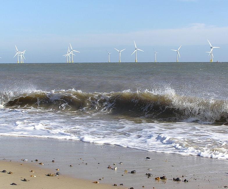Wind farm seen from the beach in Norfolk, England